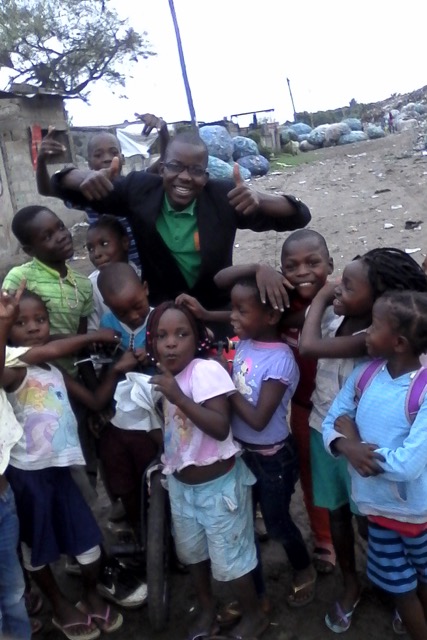 Augusto Mulima and the children at Hulene Garbage dump.jpeg