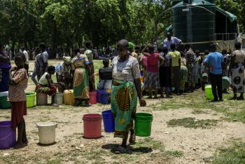 woman carrying buckets for water_0.jpg